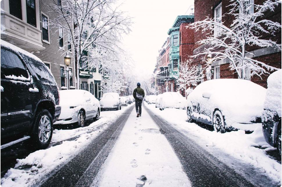 A person walking on a snowy street
 freerangestock.com, CC0.