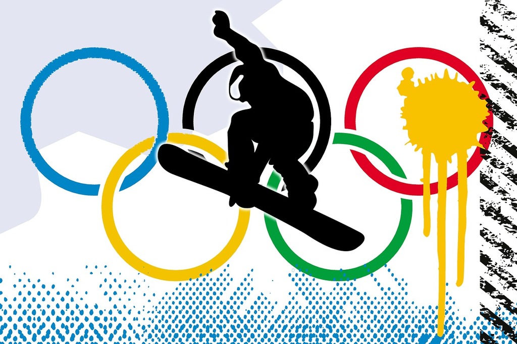  A snowboarder is in the air above the olympic rings.  getarchive.net, PDM 1.0